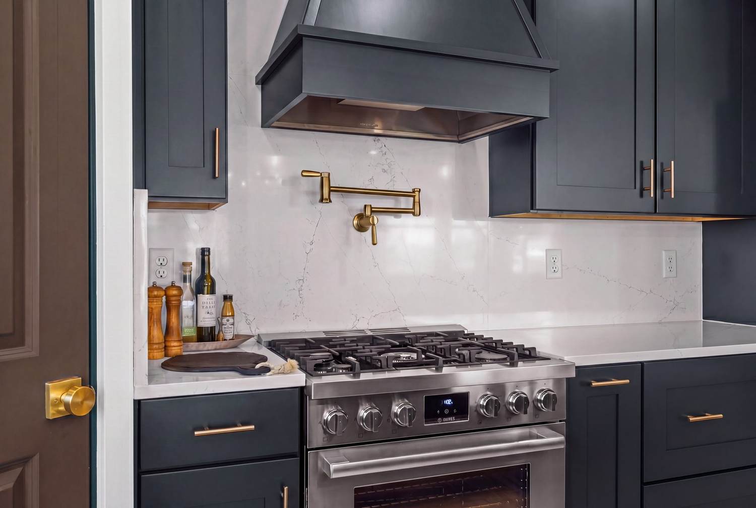 Range with custom hood and pot filler