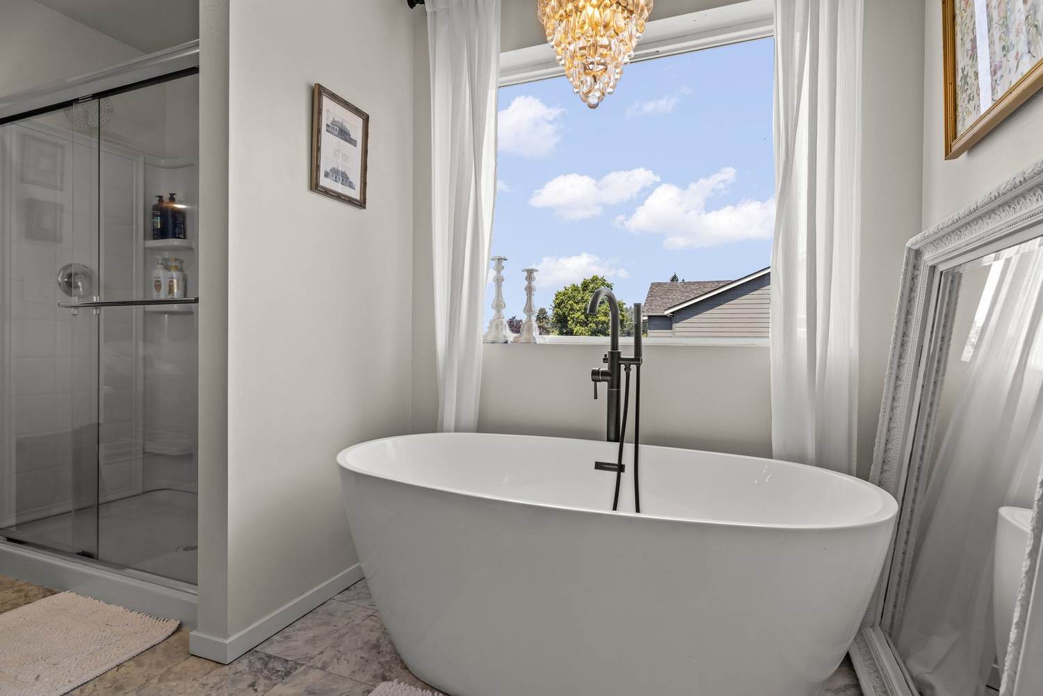 Freestanding soaking tub in the primary bath