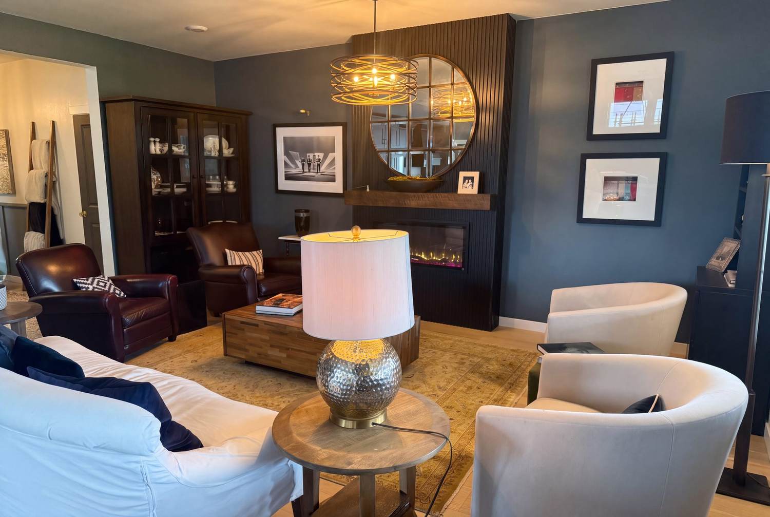 Living room seating area with designer lighting