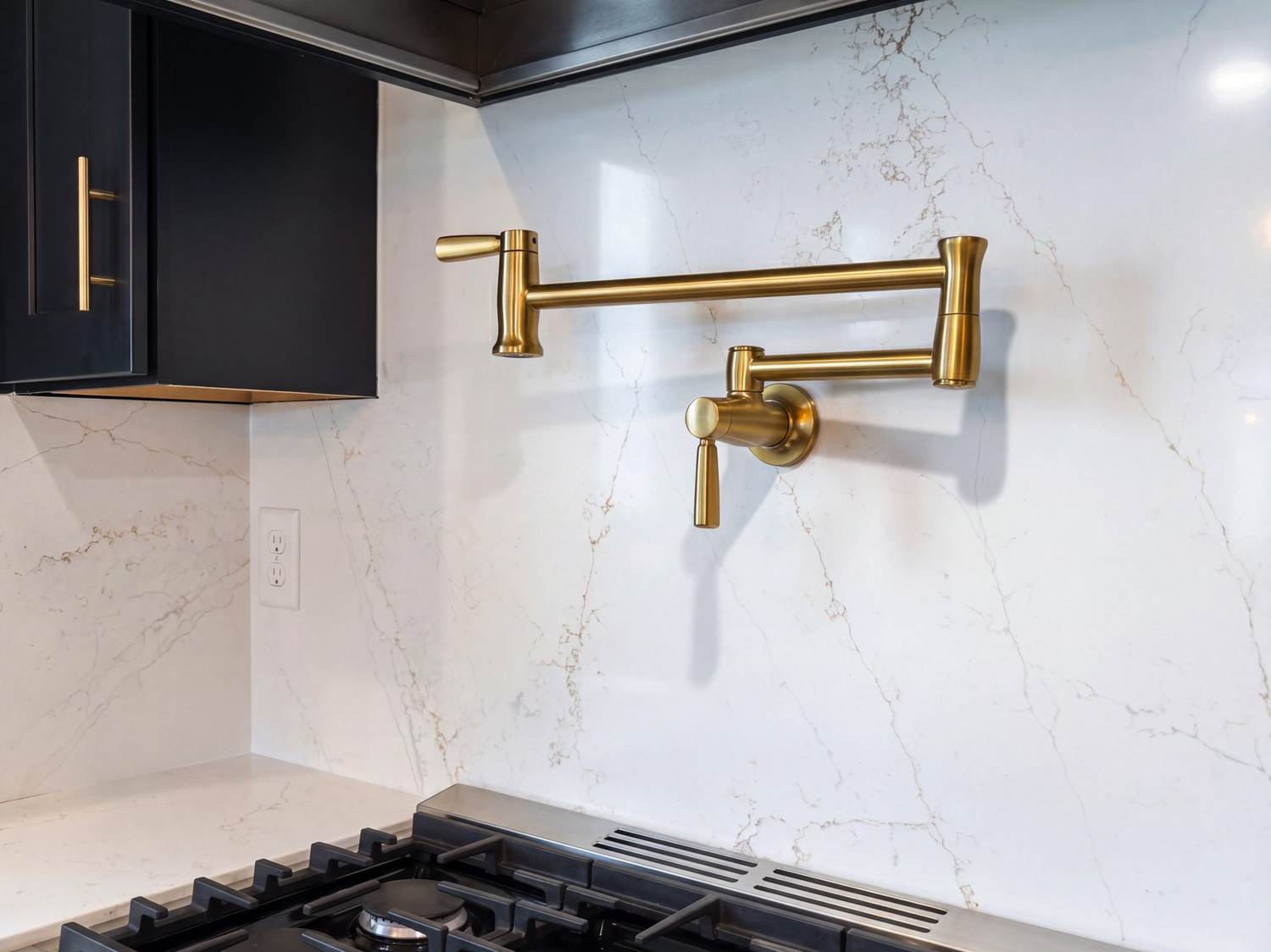 Kohler pot filler and quartz backsplash detail